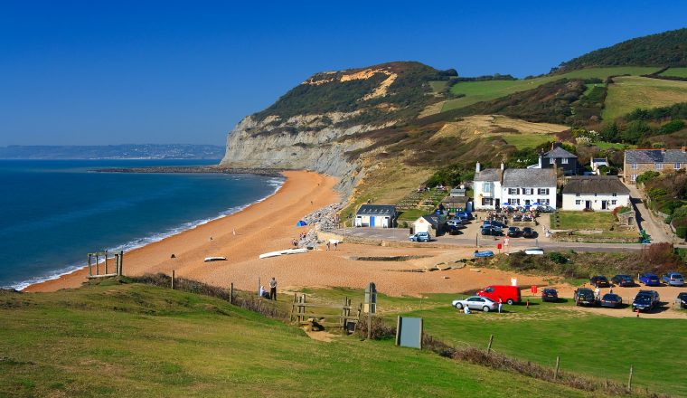 Summer day on the beach in Seatown, Dorset, UK.