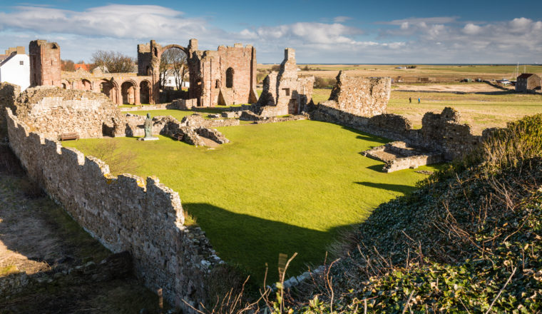 Ruins of Lindisfarne Priory on Holy Island on a sunny day