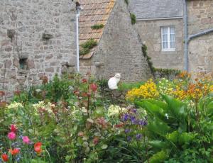 John and Heather Hunt - we walked through the French village of Montfarville, on our way to Barfleur, on the NE corner of the Cotentin peninsula in Normandy.